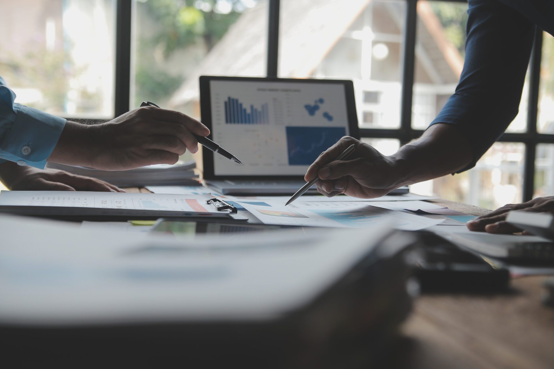 Financial analysts analyze business financial reports on a digit